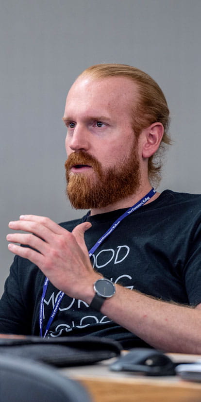 Student talking and sharing their thoughts during class.