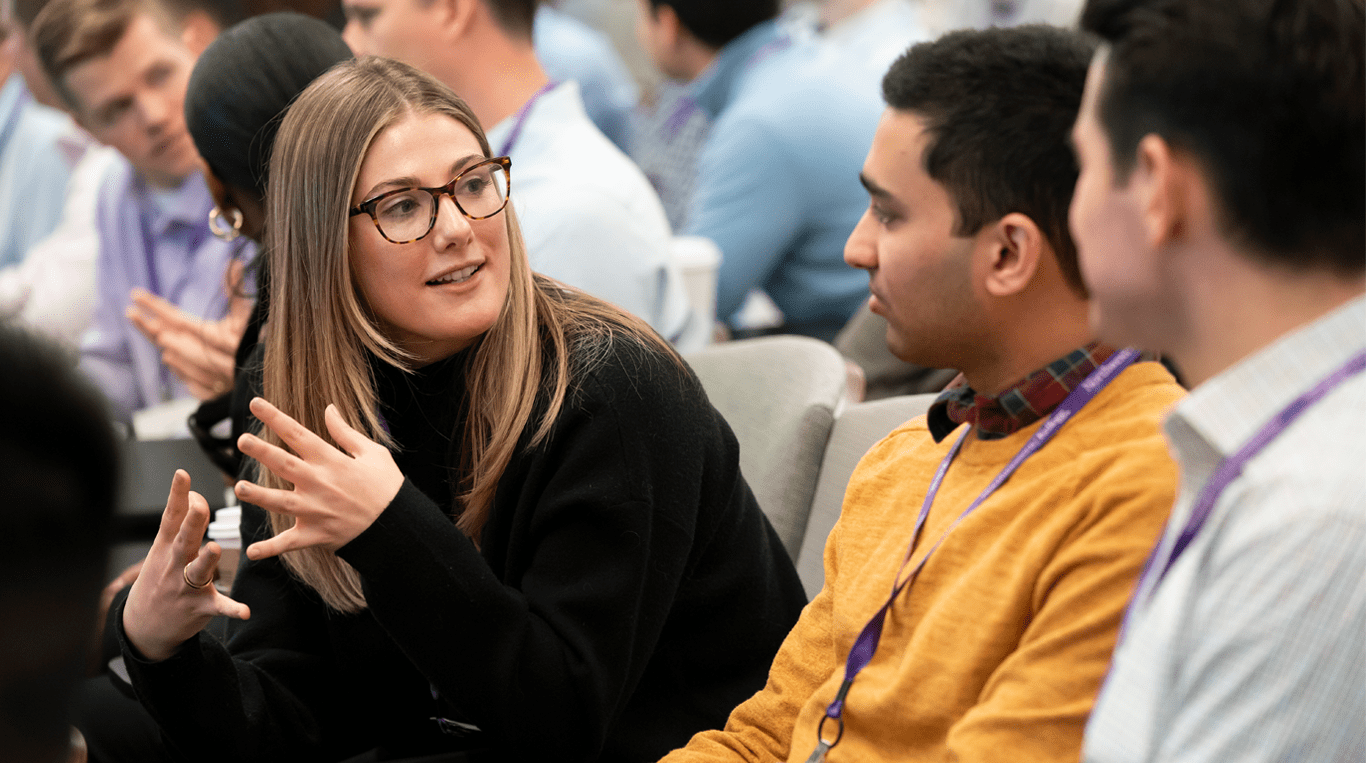 Three students look forward during a class.
