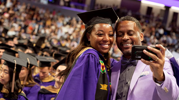 Kellog MBA student taking selfie with friend during convocation