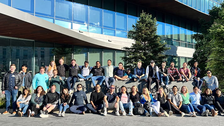 Alfredo Sone Scassi-Buffa '23 MBA and other students in front of the Global Hub 