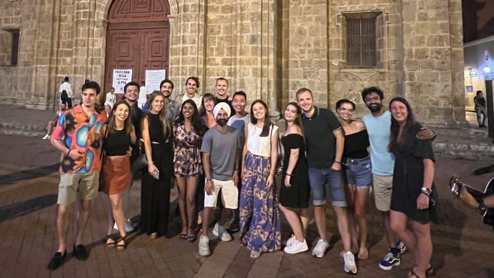 Alejandra Villamil with other Kellogg students walking streets in Portugal