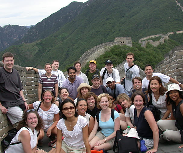 A group of students poses at the Great Wall of China while on a GIM trip in 2003
