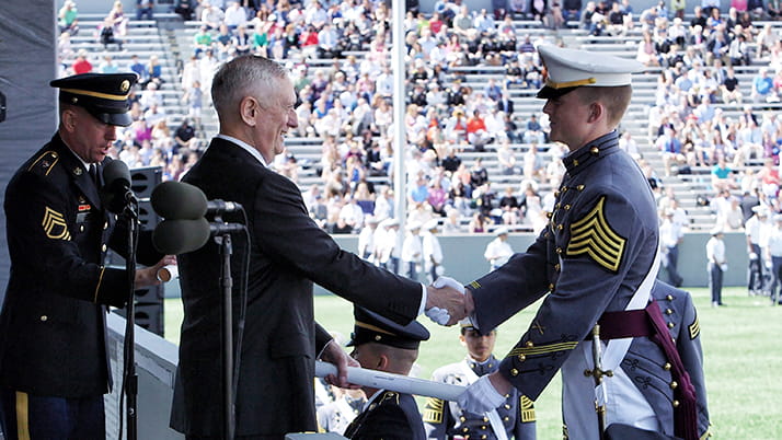 Cam Voigt, MBA candidate at Kellogg, receiving his diploma from Secretary of Defense James Mattis