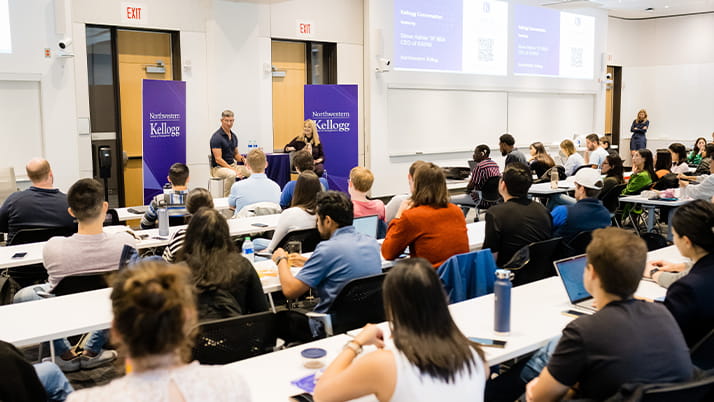 A classroom full of Kellogg MBA students listening to leadership advice from Kayak CEO Steve Hafner