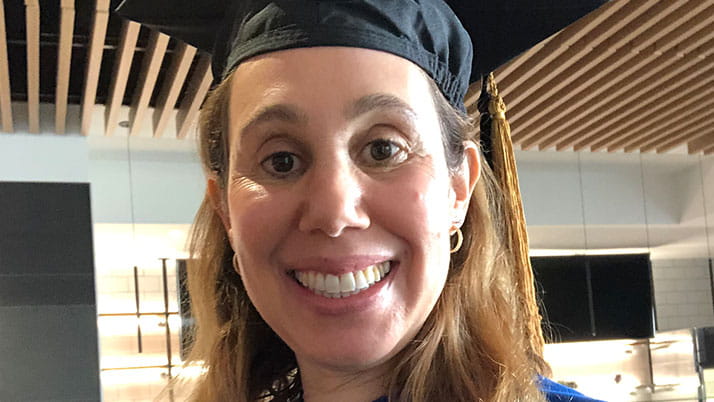 Small Wonder co-founder Stephanie Farsht wears a cap and gown on Kellogg graduation day.