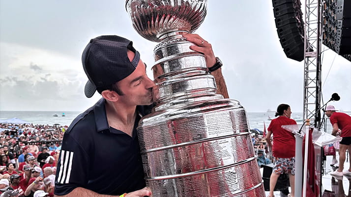 Mark Zarthar kisses the Stanley Cup trophy at the Florida Panthers victory rally.