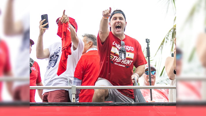 Kellogg graduate Matt Caldwell greets the crowd at the Florida Panthers Stanley Cup victory parade.