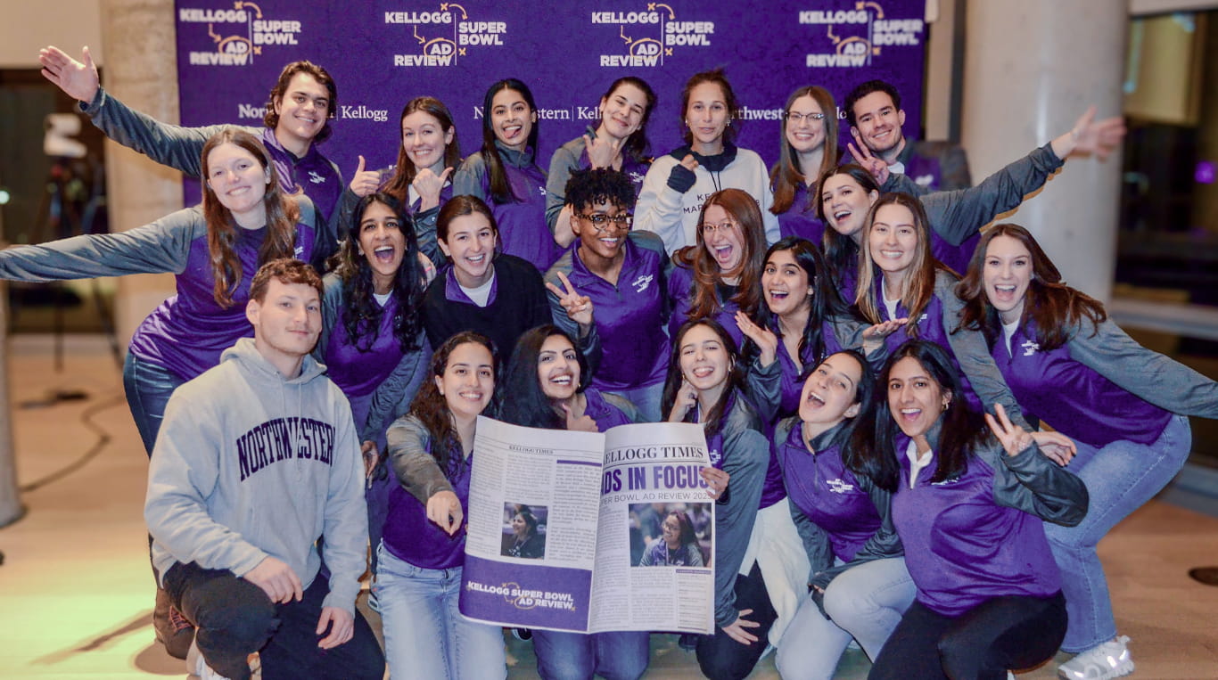 A group of Kellogg MBA students posing during the Super Bowl Ad Review in February.