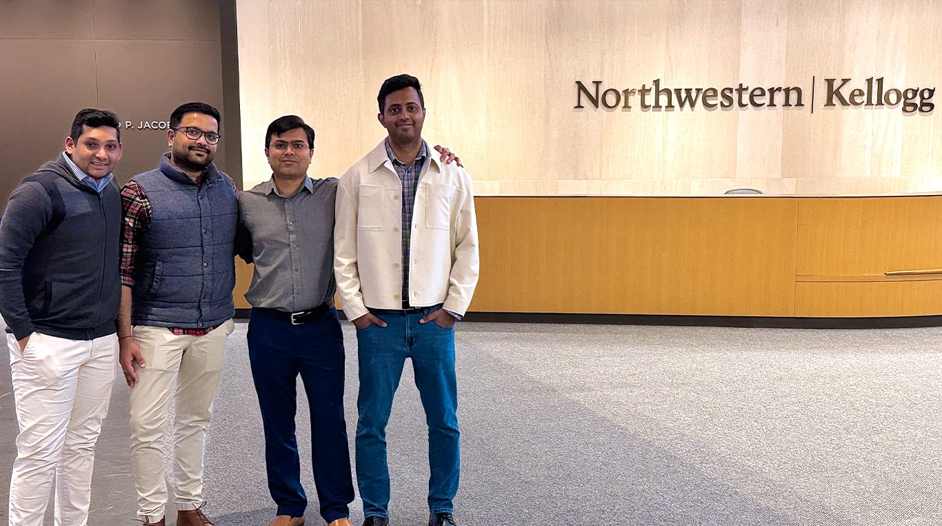 Evening & Weekend Kellogg MBA students standing at the Global Hub's lobby