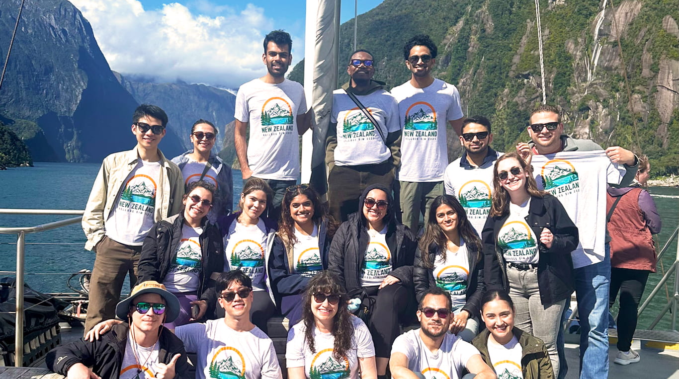 A group of Kellogg MBA students on a boat tour in New Zealand.