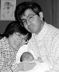 Kellogg alum with husband and new daughter