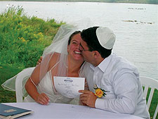 It's official! Alyson Gampel '02 and Shawn Saraga display their marriage certificate.