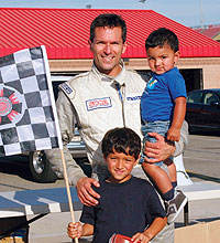 Tom Scarpello '92 at the SCCA National race in California with sons Tommy and Tony