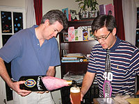 Dan Kelly (left) and Dave Mathias (both '95) celebrate Dave's 40th birthday with a large Belgian beer. 