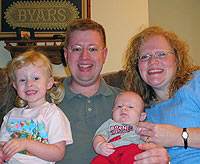 Big sister Macy Layne Byars (3), Mark Byars '02, Nicki Byars, and Spencer Mitchell Byars (2 months).