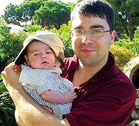 Allegra and Paolo Cuomo '03 try on hats.