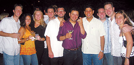 Celebrating Brian Fitzpatrick's birthday in South Beach, Miami, are, from left, John (SO) and Diane Gomez '03, Nellie and Doug Stein '04, Chris Rzymski '04, Francisco Moreno '96, Thomas Camargo '07, Neil Chernoff '03, Brian and Elaine Schulze (both '03).