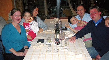 Dean Peterson '03 and family feast on traditional Italian fare with Gabriel Galeani and team '03. From left: Christy Peterson, Flaminia Galeani, Emanuela Galeani, Gabriel Galeani '03, Paolo Galeani and Dean Peterson '03.