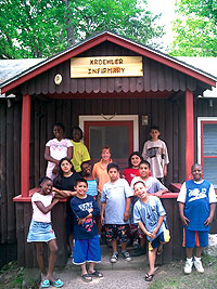 Kristine Sandrick EMP-17 and campers and in front of Kristine's "summer home".